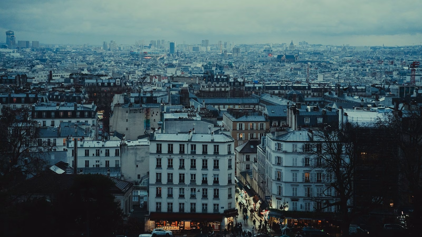 a view of a city from the top of a hill