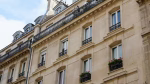 a tall building with a clock on the top of it